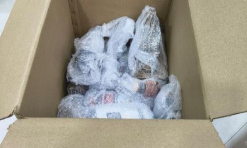 Kitchen glassware and bottles wrapped in layers of air bubble sheet by the best packers and movers