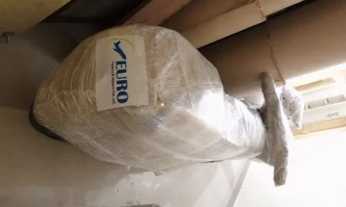 A motorcycle meticulously wrapped in protective film and bubble wrap by packers nad movers kolkata for scratch-free shipping.