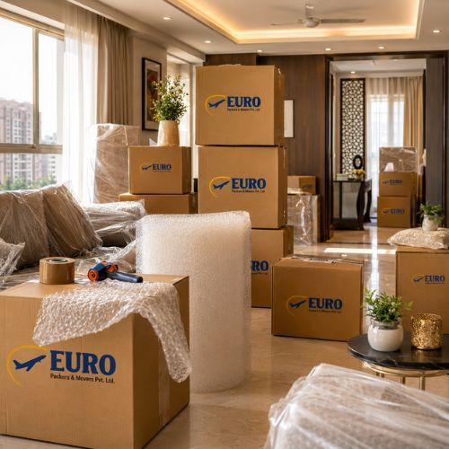 Household shifting services in Kolkata with carefully packed home furniture and boxes.g
