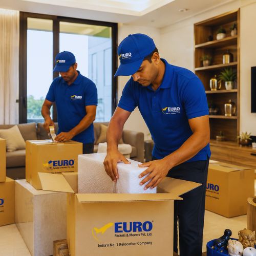 Expert packing and moving services in Kolkata with trained movers packing household goods safely.